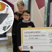 Edward (left) and Toby (right) presenting their cheque to St Elizabeth Hospice. Credit: St Elizabeth Hospice