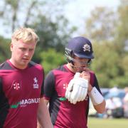 Dan Shanks, left, and Tom Harper, right, leave the pitch after their unbroken partnership of 45 boosted Suffolk to a match-winning total of 206 for 8 against Norfolk at Horsford CC last Sunday. Picture: NICK GARNHAM