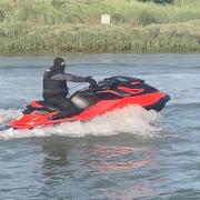 A group of men caused paddle boarders to fall into the water after driving jet skis too quickly