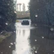 The car attempted to get through the flooded road