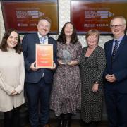 The winners of Primary School of the Year with the presenter. Left to right: Zoe Clancey, Paul Parslow-Williams, Emily Rowe, Carol Peters and Miles Cole from University of Suffolk, who presented the award