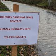 Signs have appeared on the B1119 ridiculing the council for their flood management