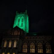 Why did St Edmundsbury Cathedral turn green last night?