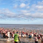 Hundreds of people wore Christmas hats as they braved the North Sea