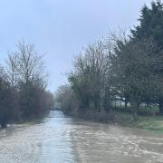 Colchester Road in Bures is flooded