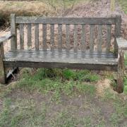 The bench set up as a memorial to Alastair Douglas, which was thrown into a pond, but has since been restored to its previous position
