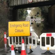 The road has been shut due to flooding under the bridge
