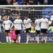 Ipswich Town players react after turning victory into defeat in stoppage-time at Cardiff City.