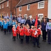 Barrie Hayter, pictured right with 5th Woodbridge Sea Scouts at a Remembrance Day parade in 2023, is leaving the scouts after five years