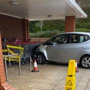 The car has crashed into a row of trollies