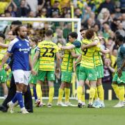 Norwich City players celebrate following their 1-0 win against Ipswich Town at Carrow Road.