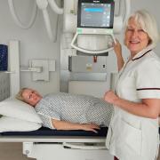 Radiographer Alison Oughton x-raying Sandra Chandler, who became the first patient to use the machine.