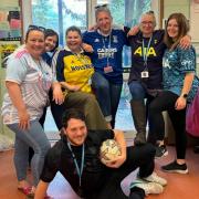 Tom Ramsden - centre - has been raising money for his best mate Gary. Today, he and staff at Suffolk Rural backed Football Shirt Friday to raise money and awareness of cancer research