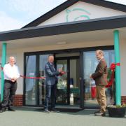 Felixstowe mayor Seamus Bennett cuts the ribbon to launch the new Ryder Davies & Partners vets practice in Felixstowe. He is pictured with Joe Steventon and Ben Ryder-Davies, partners in the business