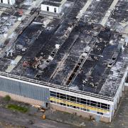 The company that bought the former Delphi Sudbury factory site that caught fire this week owes a council over £300,000 in business rates