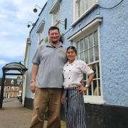 Left, Stuart O'Neill pictured with his wife Chan outside of The Castle Inn where they have operated the Three Cooks since 2021