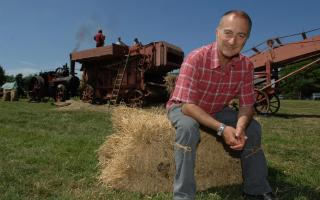 Sir Tony Robinson, pictured in 2005, is recording at Sutton Hoo in Suffolk