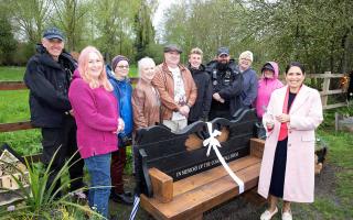 Priti Patel has payed tribute to swans that were catapulted to death in Coggeshall by opening a memorial bench
