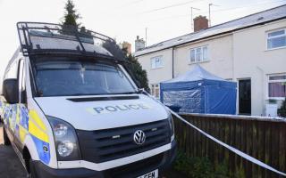 Cordons were in place outside the property in Exning Road