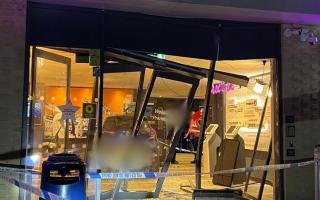 A man remains in hospital after a car crashed into Premier Inn in Bury St Edmunds