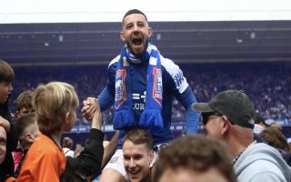 Conor Chaplin is held aloft as Ipswich Town celebrate promotion to the Premier League.